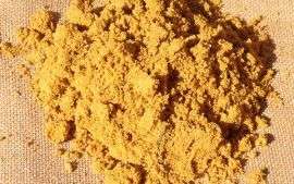 A small pile of bricklaying sand, the sand has a lovely golden hue, perfect for construction.