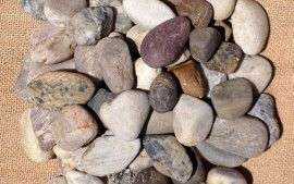 A mixed variety of polished pebbles, in white, grey, brown a red. Size 20mm - 40mm.